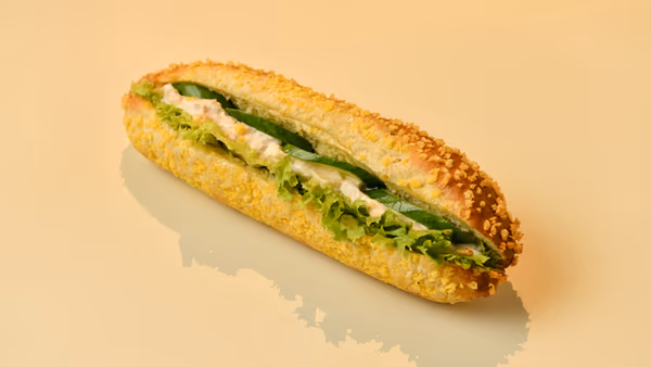 Homemade Tuna Salad in Lettuce Leafs with Cucumber in a Corn Baguette