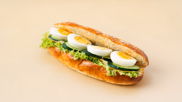 Metsovone Cheese with Boiled Eggs in Sesame Baguette Brioche