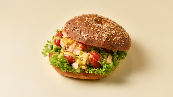 Roasted Salmon with Fresh Vegetables with Wasabi Sauce in Multigrain Bagel